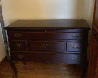 Lot 147: Dark wood dresser with brass hardware