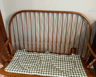 Lot 185: Wooden spindle-back bench with plaid cushion