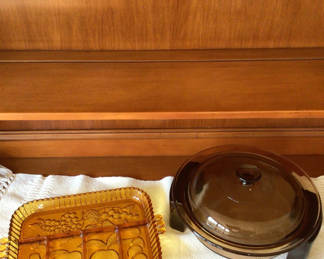 Lot 243: Amber glass divided serving tray and glass-lidded chafing dish