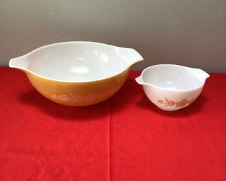 Lot 2: Pyrex floral-pattern mixing bowls (large yellow and small white)