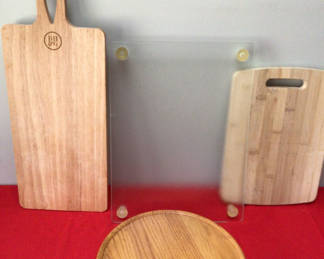 Lot 12: Wooden cutting boards, a round serving/trivet disk, and a frosted glass panel