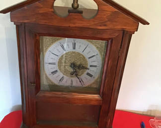 Lot 78: Antique wooden clock cabinet with glass front