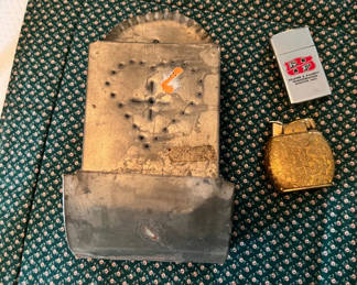 Lot 223: Vintage lighters and match holder