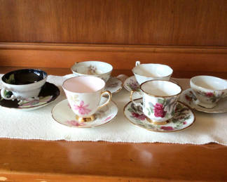Lot 246: Floral bone china teacups and saucers with gold trim
