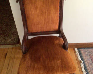 Lot 144: Carved wooden armchair with orange velvet upholstery