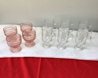 Lot 22: Pink stemmed goblets and clear etched mugs