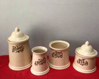 Lot 13: Ceramic canister set labeled Flour, Utensils, Coffee, and Tea