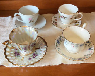 Lot 245: Set of vintage floral teacups and saucers