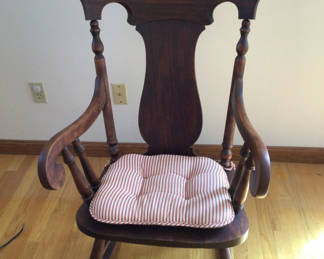 Lot 199: Wooden rocking chair with striped cushion