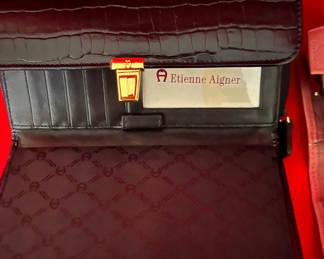 Lot 238: Etienne Aigner black wallet and Buxton pink crocodile-embossed wallet
