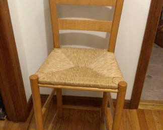 Lot 165: Wooden ladder-back chair with woven seat