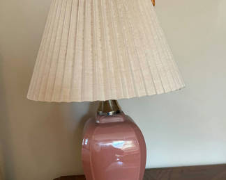 Lot 225: Pink ceramic lamp with a silver base with pleated shade