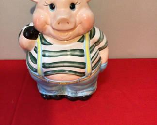Lot 40: Ceramic pig figurine with striped shirt