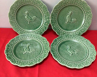 Lot 8: Set of four green ceramic plates with rooster motif