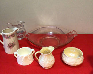 Lot 47: Porcelain creamers, sugar bowl, small pitcher, and pink glass serving dish set