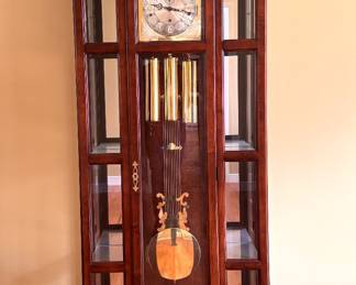 Howard MIller grandmother clock with display cabinet