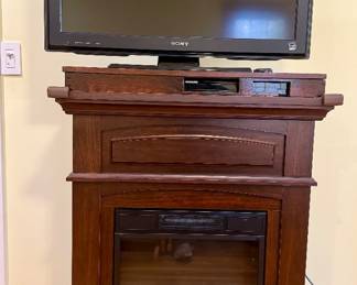 TV and TV Stand, Built-In Electric Heater, DVD Player Compartment, (Sony Bravia TV included)