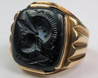 005 10K Gold Black Onyx Signet Ring With Carved Warrior