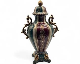Lot 319  Ornate Porcelain Urn Featuring Lidded Design And Classical Motifs