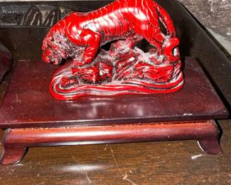 Red Lacquered Tiger Figurine on Wooden Stand