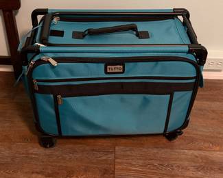 Jh Machine on Wheels is a specialized rolling case designed for transporting sewing machines, sergers, or other large crafting equipment