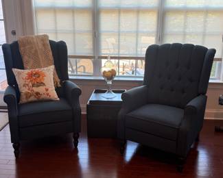 Pair of navy tufted reclining wing back chairs 