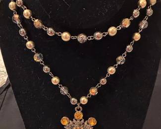 Multi-strand Beaded Necklace with Starburst Pendant