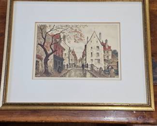 Lot #130 -  Vintage Framed Lithograph "A Street In Grande France" by L. Henri Poissones. 