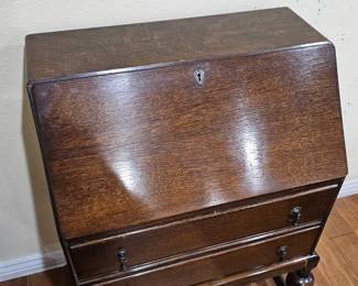 Lot #127 -  Antique Oak Drop Front Secretary Desk with Turned Legs and Metal Hardware