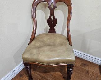 Lot #128 -  Antique Victorian Balloon Back Side Chair with Leather Upholstery and Brass Casters