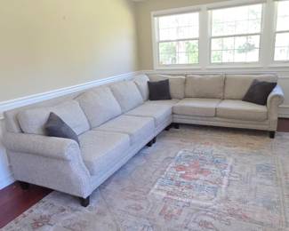 Lot #63 - Fusion Furniture Gray Upholstered Sectional Sofa with Nailhead Trim and Rolled Arms