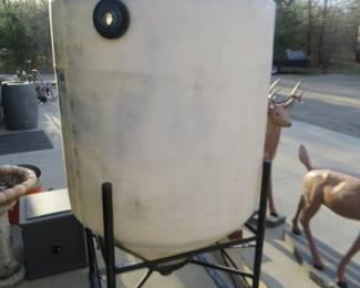 Lot 432. 200 gallon water tank with metal stand. 78" tall