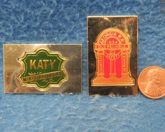 Lot 315. Two sterling silver ingots from "The Great American Railroad Emblems" series. The Missouri Kansas Texas (The Katy) and the Georgia. Total weight 45.51 grams.