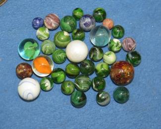 Lot 212. Marbles in a glass canning jar including shooters and clay marbles