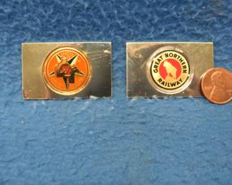 Lot 319. Two sterling silver ingots from "The Great American Railroad Emblems" series. The Great Northern and the Texas Mexican. Total weight 45.07 grams.