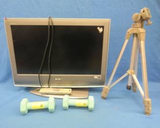 Lot 219. Sony LCD color TV (powers up), 5 lb. hand weights, and a tripod.