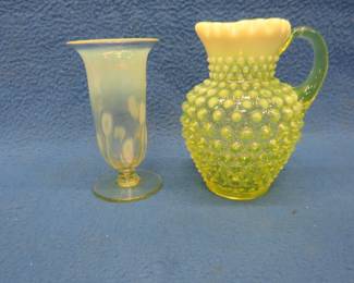 Lot 79. Two uranium glass pieces. Yellow/green with opalescence. A Fenton Topaz hobnail pitcher and a vase.