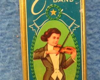 Lot 251. New old stock Artist's Band F.A. Bohm 10-hole harmonica and tin box in the key of C.