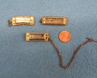 Lot 58. Three mini harmonicas: C.A. Seydel Sohne 5-hole Koh-I-Noor charm harmonica. Works. In this auction's 'Auctioneer's Notes,' we list John Whitman's Harmonica Anthology 11th Ed. April 25, 2019 as a free and easy source to get more information about specific harmonicas. The harmonica in this lot or one like it can be found at page 512. Yamaha 4-hole tie chain charm harmonica. The Boys Own charm harmonica. All work.