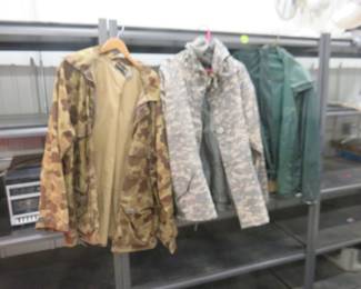 Lot 309. Three raincoats. Sizes as pictured.