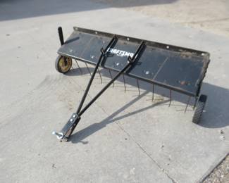 Lot 305. Craftsman pull-behind dethatcher. 41" wide.