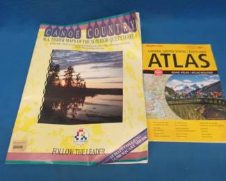 Lot 117. BWCA Canoe Country maps and a US/Canada road atlas.