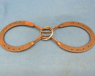 Lot 289. Horseshoe puzzle. Directions not included.
