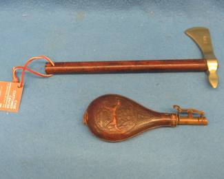 Lot 23. Antique leather powder flask and a souvenir Case brass hatchet