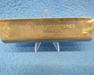Lot 204. Vintage C. H. Weiss The Brass Band 20-reed tremolo harmonica in the key of A with "Extra Full Tone". Sounds great.