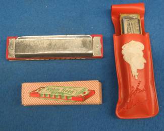 Lot 159. Three vintage harmonicas: Herb Shriner's Hoosier Boy 10-hole diatonic harmonica in the key of C and vinyl case. Sounds great. Music Masters 12-hole diatonic harmonica made in Korea. Robin Hood Shoes advertising 6-reed harmonica and box.