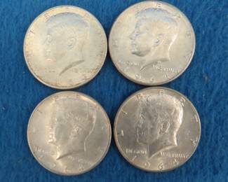 Lot 268. Four 1964 Kennedy half dollars