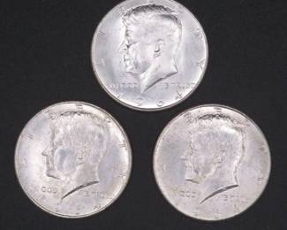 Lot 240. Three Kennedy 1964 Half Dollars that came to us in an unopened bank roll.