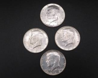 Lot 87. Four 1964 P Kennedy Half Dollars. These were ender coins on two bank rolls, so they are high grade on one side