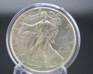 Lot 181. Uncirculated and encapsulated 2021 Silver Eagle with the the heraldic eagle on the reverse